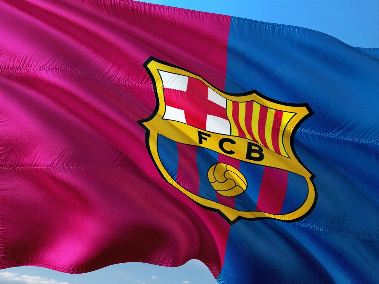 A packed stadium filled with passionate fans eagerly anticipates the kickoff of a pivotal Champions League match
