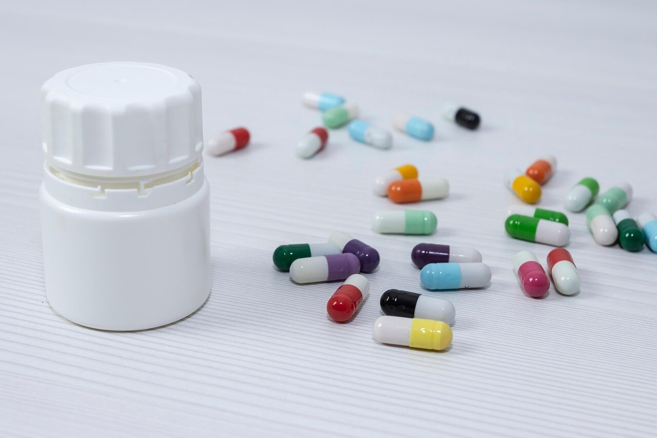 Healthcare professionals reviewing research data on the efficacy of GLP1 drugs for postpartum women during a conference