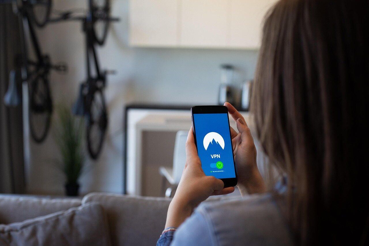 A person enjoying seamless streaming on a tablet, showcasing the advantages of using a VPN for accessing georestricted content