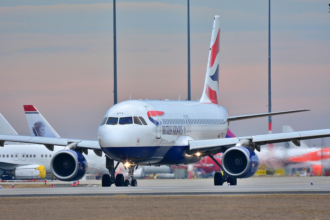 A closeup view of an Airbus A320 aircraft on the runway, highlighting its sleek design and modern technology
