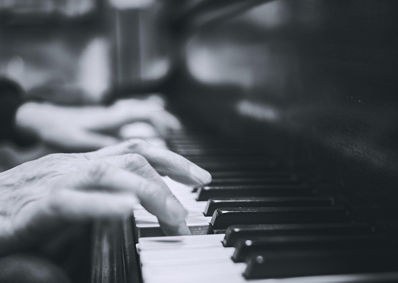 An intimate gathering of musicians collaborating on free jazz compositions, emphasizing the genre's communal and improvisational spirit