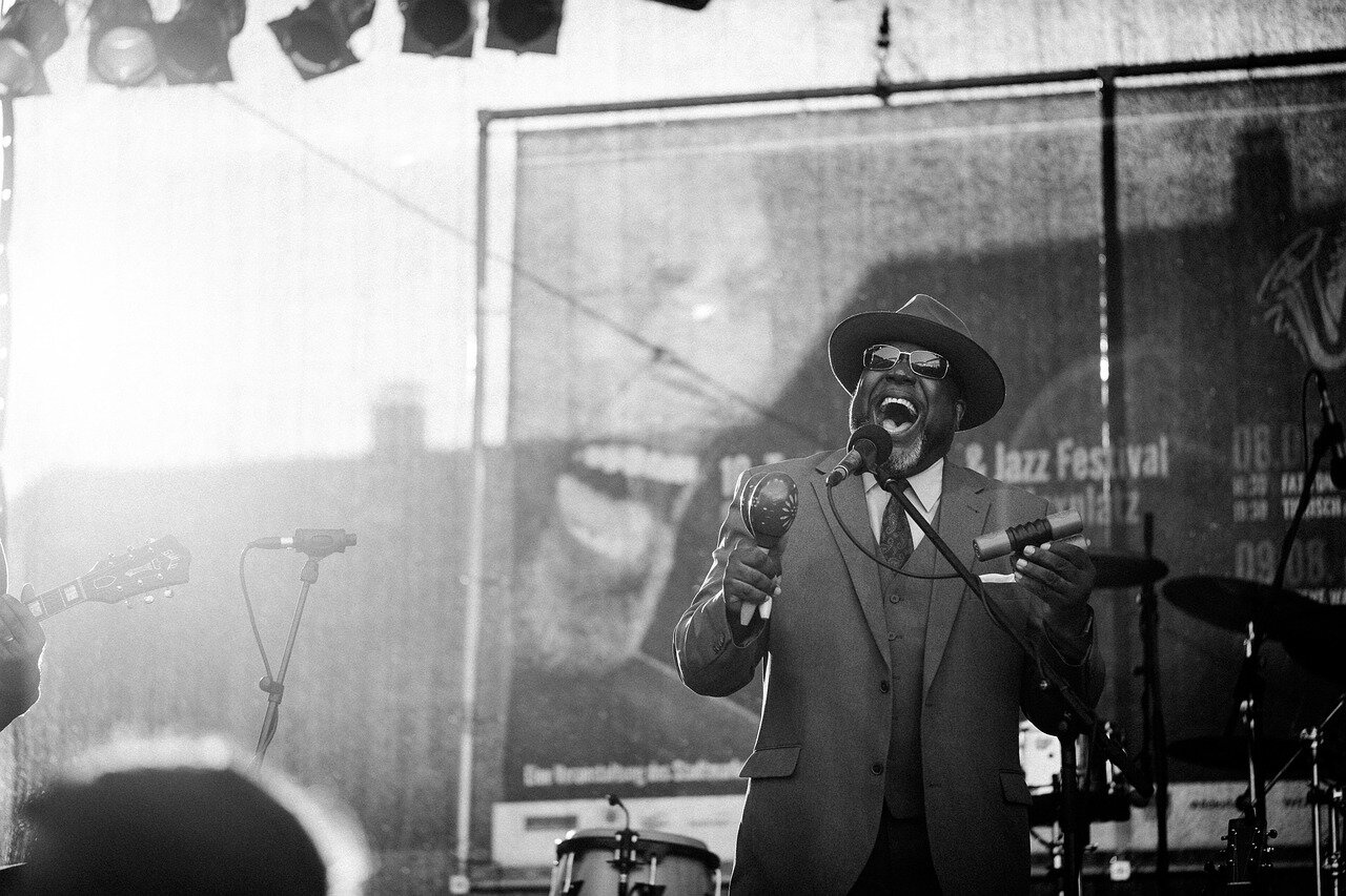A historical photograph of Ornette Coleman performing, representing the groundbreaking influence of free jazz in the 1960s