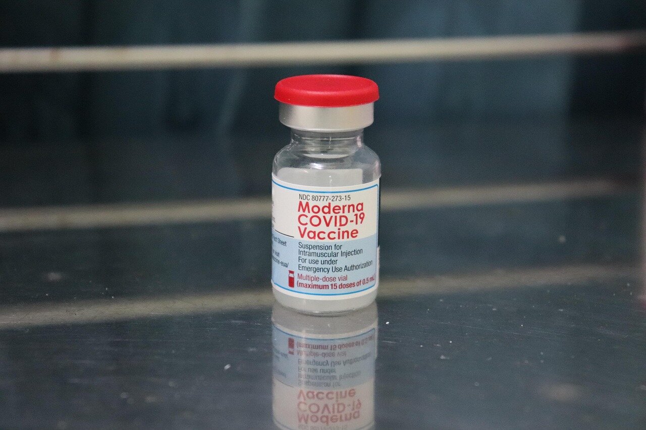 A healthcare provider examines a newborn, emphasizing the importance of timely vaccinations to prevent hepatitis B transmission