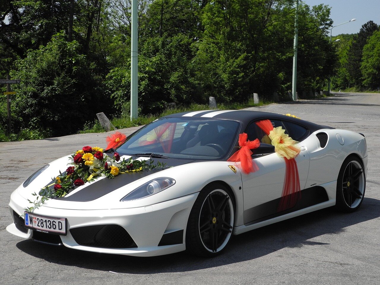 An image of social media posts highlighting the heated debates among fans regarding Ferrari's transition to the electric vehicle market