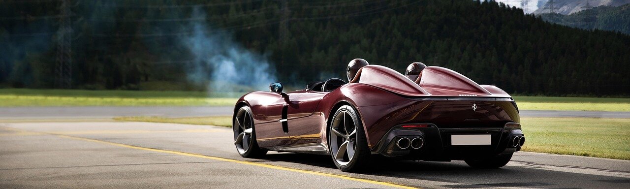 Government officials reviewing policies that favor local electric vehicle production, illustrating the regulatory environment affecting foreign automakers like Ferrari
