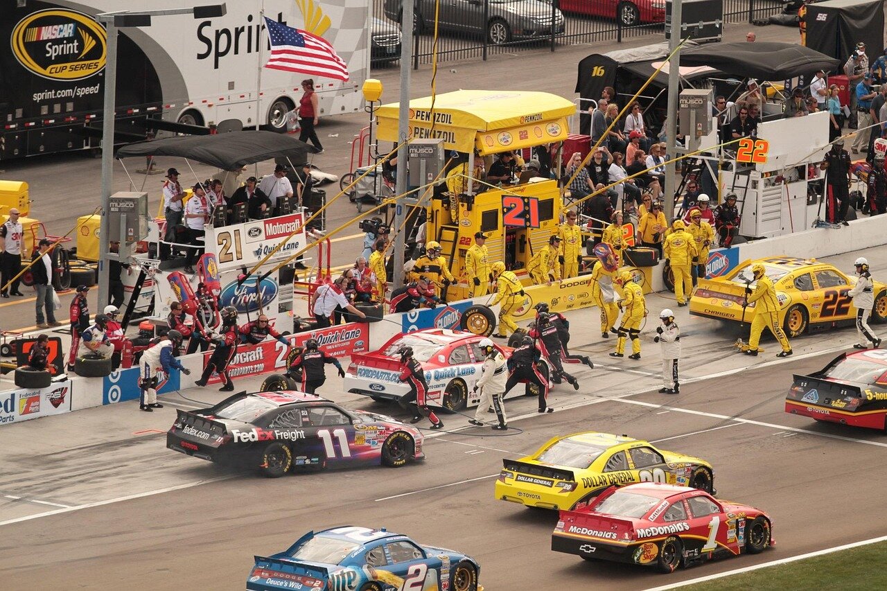 Kyle Busch competing fiercely on the racetrack, showcasing his aggressive racing style and competitive spirit