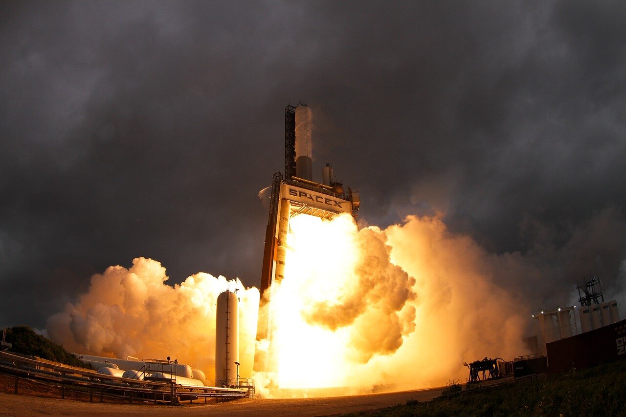 Engineers and technicians collaborating on the Starship program, highlighting the teamwork and innovation involved in overcoming technical challenges