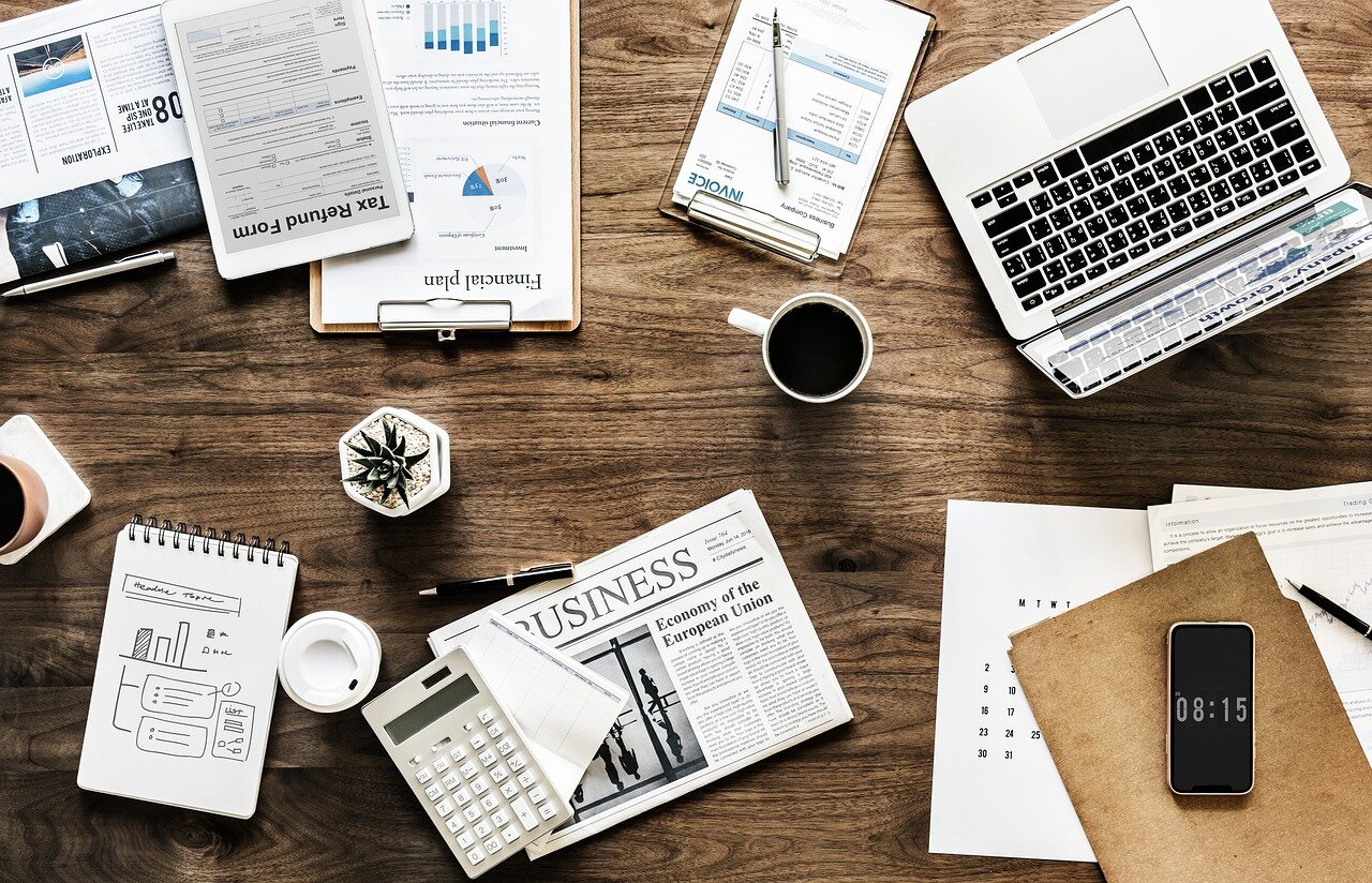 A venture capitalist reviews a pitch deck alongside a captivating hype video, assessing the potential of a new tech startup