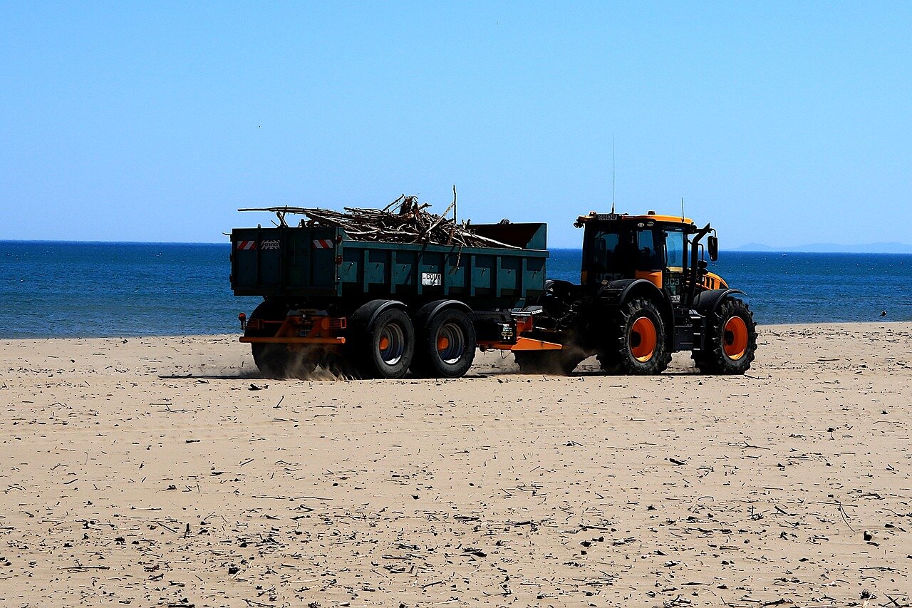 A municipal cleanup crew working diligently to remove illegally dumped waste from a public area, showcasing the impact of improper disposal