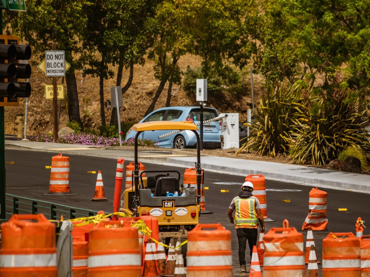 A Waymo robotaxi is seen parked on a flooded street in San Francisco, highlighting the challenges faced by autonomous vehicles during adverse weather conditions.
