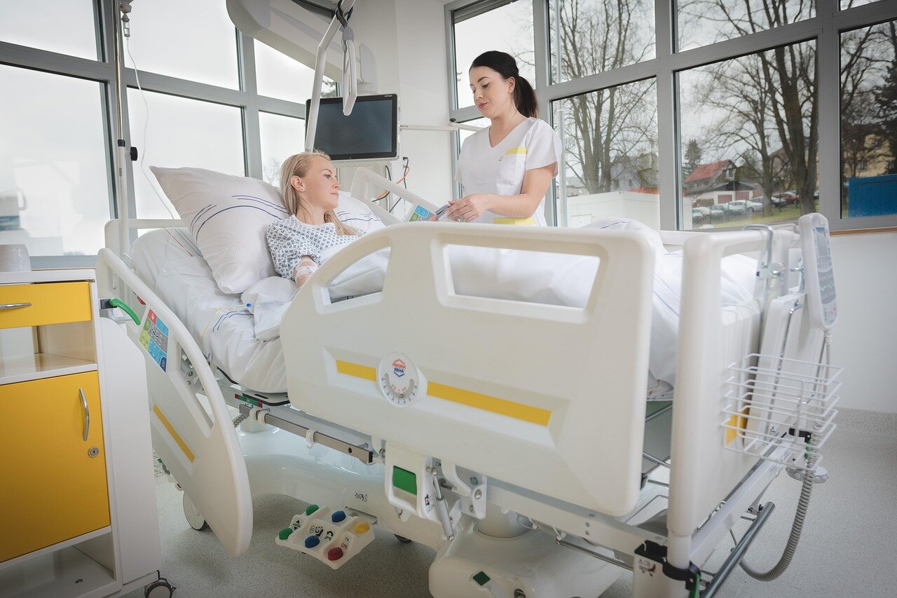 Healthcare professionals engage with patients in the rooftop ward, emphasizing the importance of natural light and fresh air for recovery