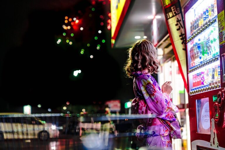 A crowded supermarket aisle shows shoppers examining empty shelves where plastic bags and packaging materials are typically stocked, highlighting the ongoing shortage in Japan.