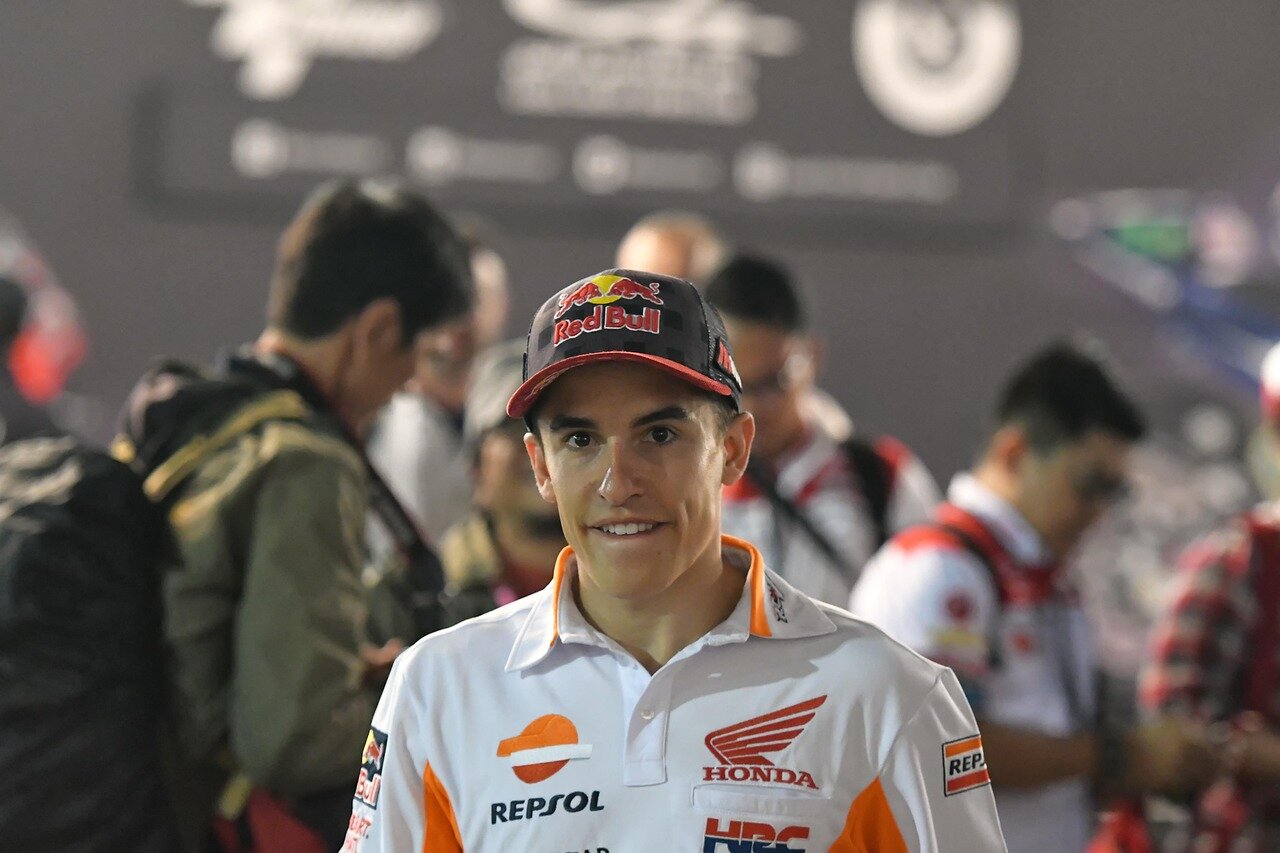 Iker Lecuona is seen preparing for his return to MotoGP, donning his racing gear and discussing strategy with team members in the paddock ahead of the Australian GP.