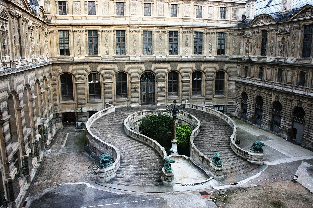 JR's installation on the Pont Neuf transforms the historic bridge into a vibrant mountainous landscape, captivating onlookers with its surreal blend of urban architecture and nature.