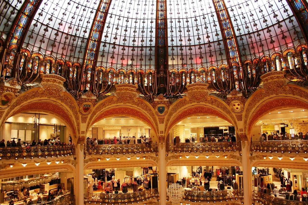 Visitors admiring the breathtaking installation that transforms the iconic Parisian landmark into a vibrant canvas of creativity