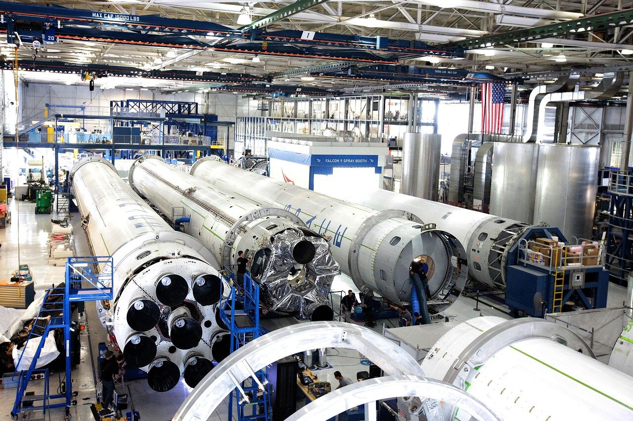 A bustling scene at SpaceX's headquarters in Hawthorne, California, showcasing the vibrant atmosphere of innovation and teamwork among employees