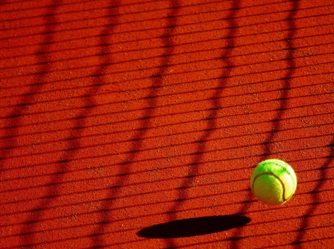 A young athlete practicing alone on a court, showcasing both their skill and the solitude often experienced by lowerranked players