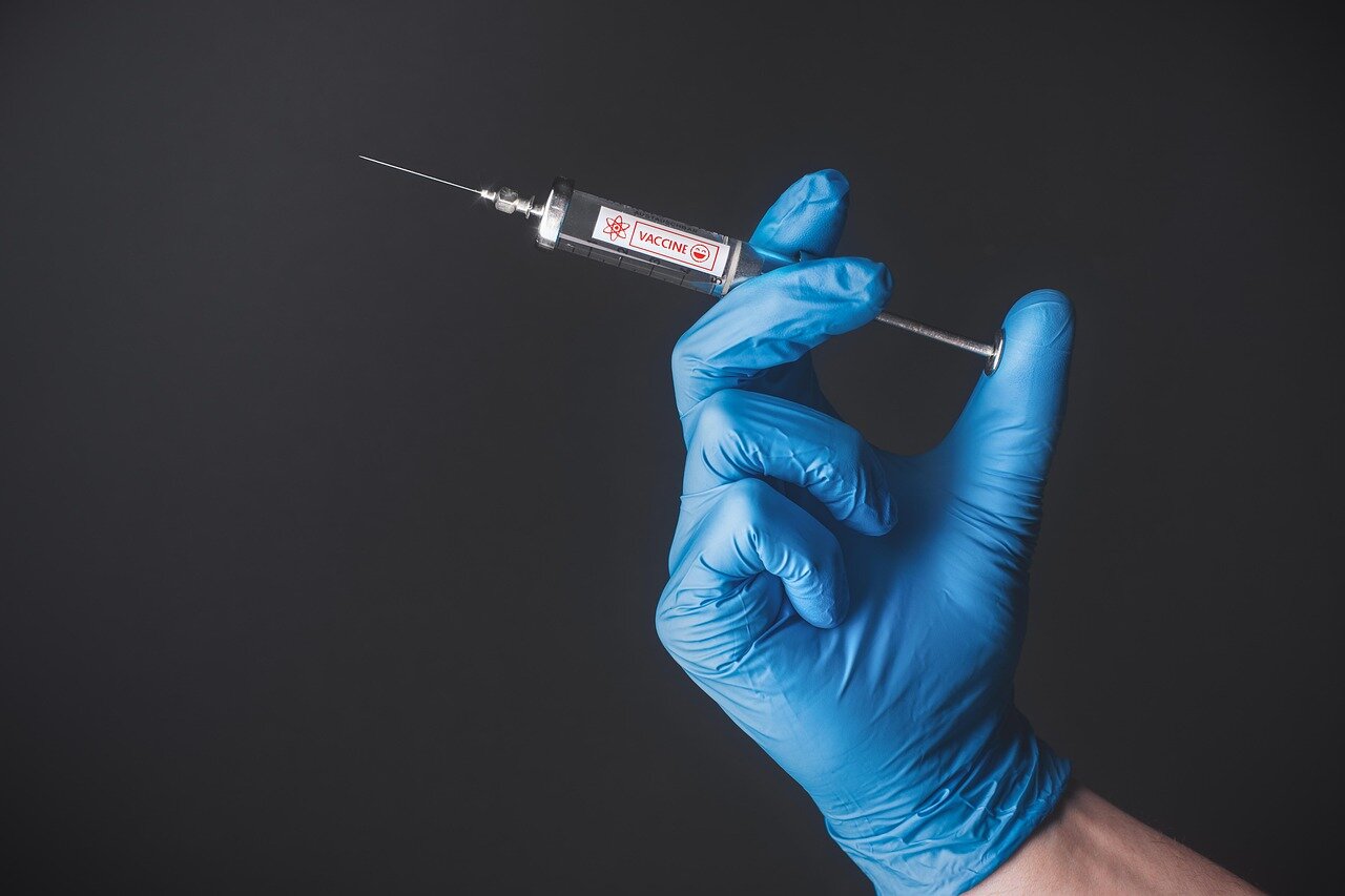 An illustration depicting the historical evolution of vaccines, highlighting key milestones from the smallpox vaccine to the modern AIdesigned vaccine approach