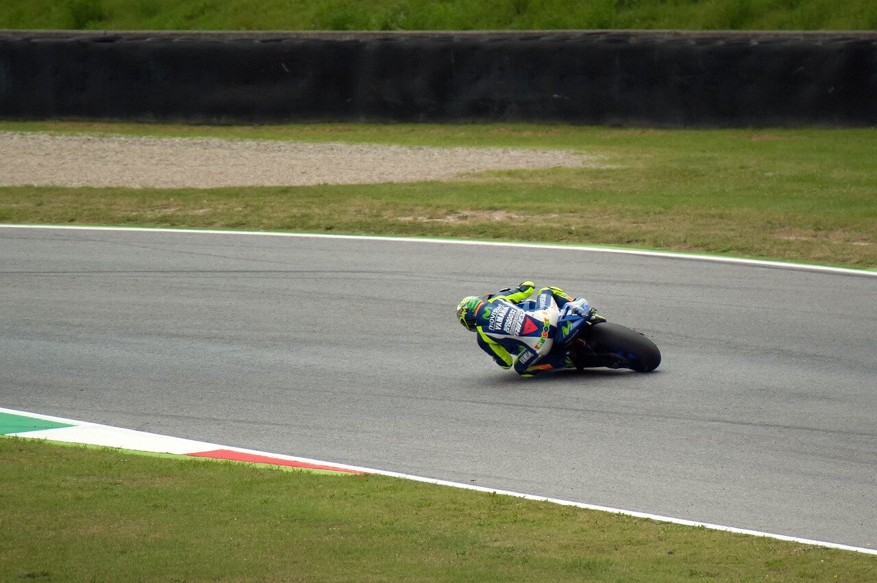 Marco Bezzecchi is seen on the ground after his crash, highlighting the intense and unpredictable nature of MotoGP racing