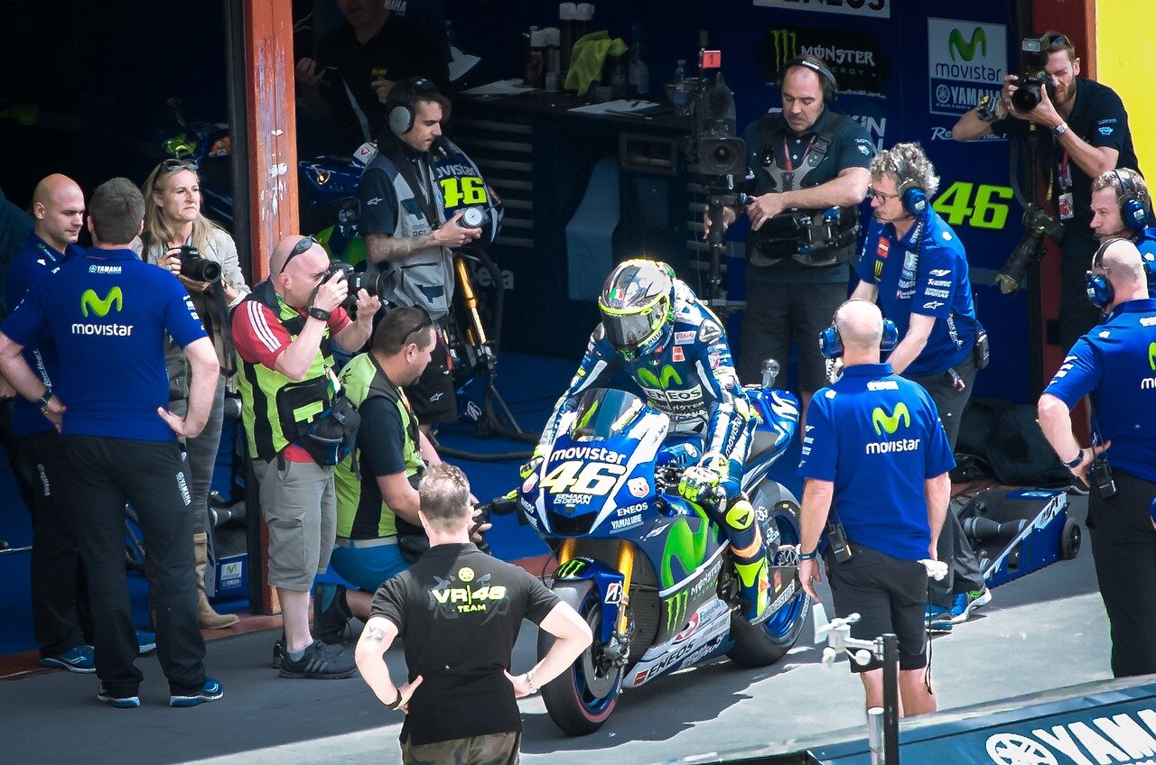 A closeup of Ogura's motorcycle as he crosses the finish line, marking a significant milestone in his racing career