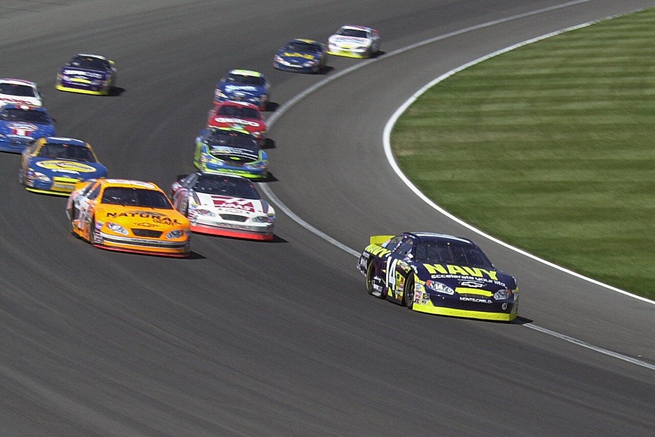 Tyler Reddick crossing the finish line in a strong second place, showcasing his rising talent in NASCAR