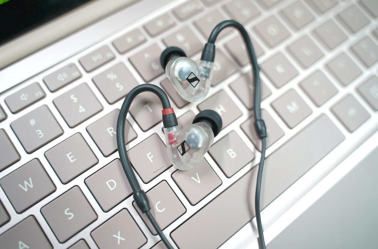 An individual enjoying music with the Momentum 5 headphones on, highlighting the immersive sound experience and comfort that these headphones provide during extended use