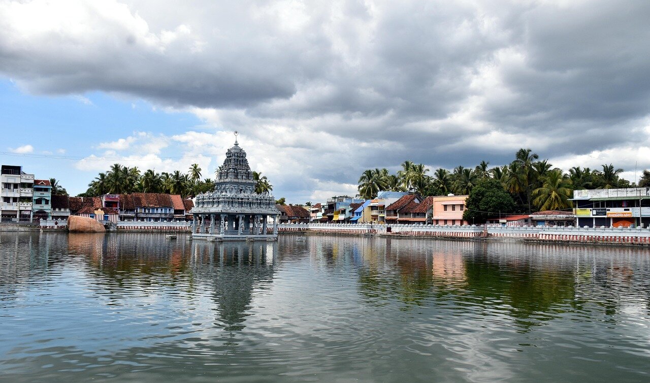 Devotees gather at a centuriesold temple in Tamil Nadu, surrounded by intricate carvings and vibrant decorations, as they participate in a traditional festival celebrating the region's rich cultural heritage.