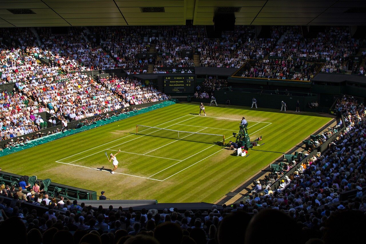 A closeup of tennis players during a heated match, illustrating the competitive spirit and talent that defines Wimbledon
